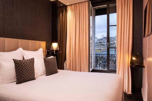 Habitación Individual Estándar del hotel First Paris Tour Eiffel. Foto 1