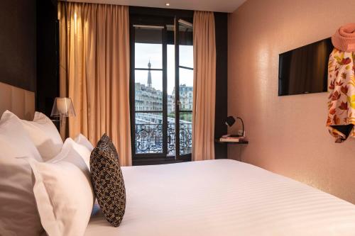 Habitación Individual Estándar del hotel First Paris Tour Eiffel. Foto 2