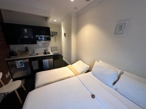 Habitación Doble Deluxe con cama supletoria del hotel East Village
