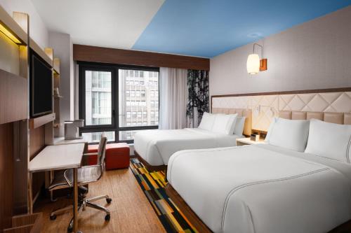 Habitación Doble Estándar - 2 camas dobles - Adaptada para personas con problemas de comunicación del hotel EVEN Hotel Times Square South. Foto 4