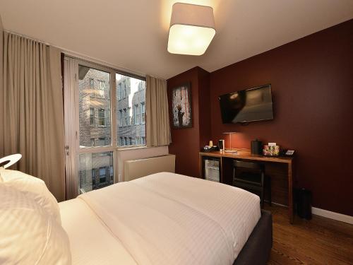 Suite Doble Deluxe - Cama grande del hotel 32 32. Foto 1