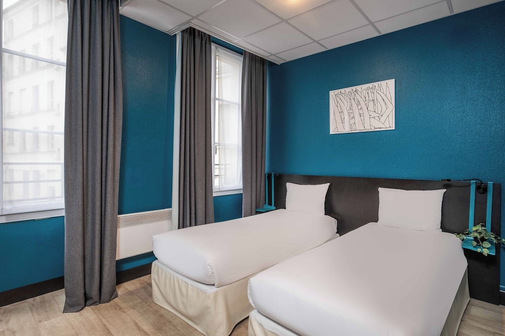 Habitación con 2 camas individuales del hotel Daval