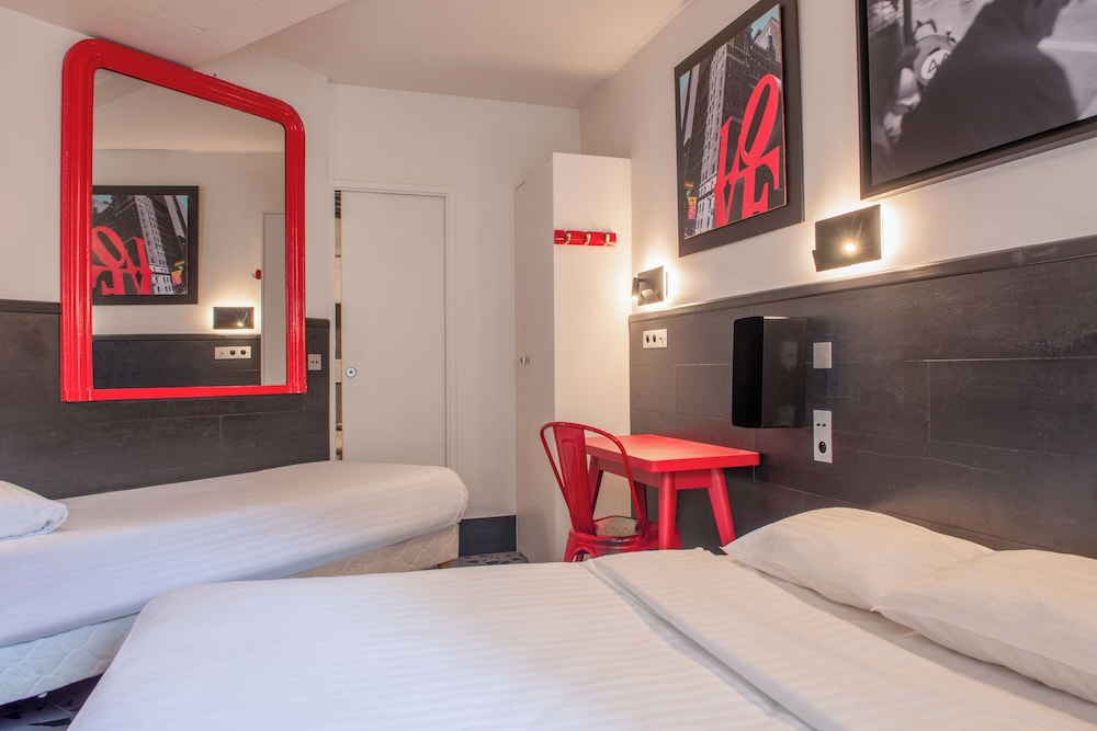 Habitación con 2 camas individuales del hotel De Roubaix. Foto 6