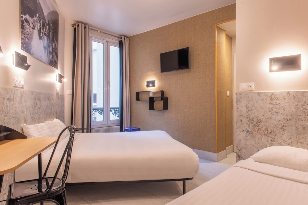 Habitación con 2 camas individuales del hotel De Roubaix. Foto 9
