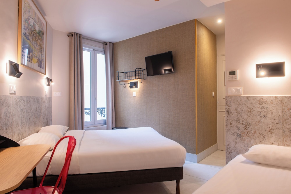 Habitación con 2 camas individuales del hotel De Roubaix. Foto 10