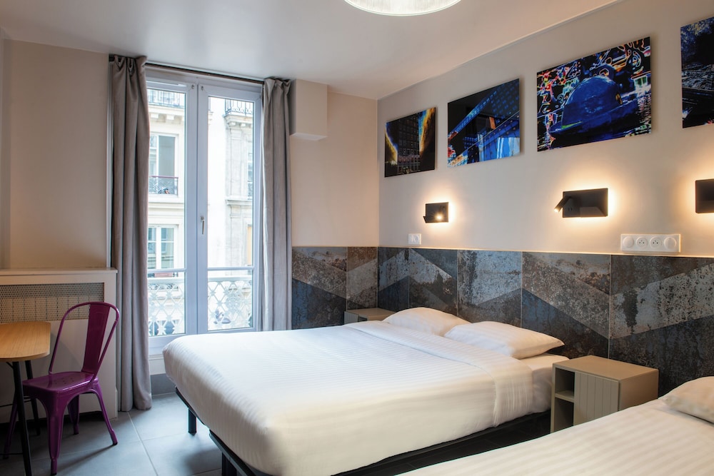 Habitación con 2 camas individuales del hotel De Roubaix. Foto 12