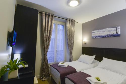Habitación Triple del hotel Du Quai de Seine. Foto 1