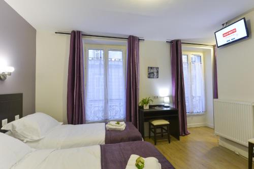 Habitación Triple del hotel Du Quai de Seine. Foto 3