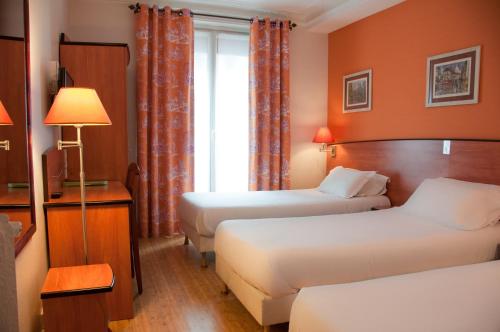 Habitación Triple del hotel Eden Montmartre. Foto 5