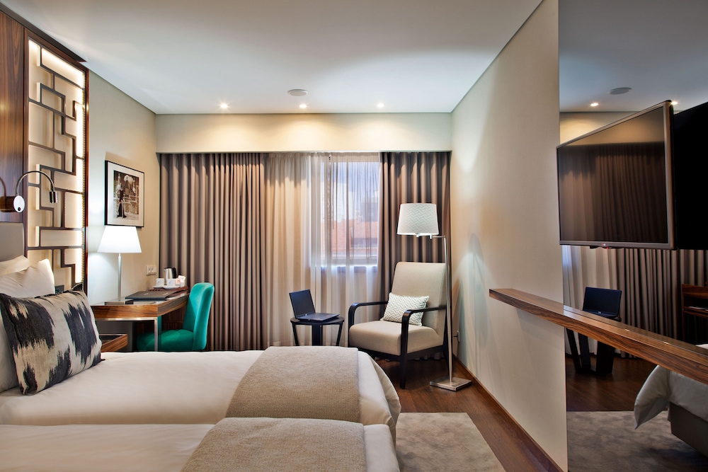 Habitación con 2 camas individuales del hotel Turim Saldanha. Foto 1