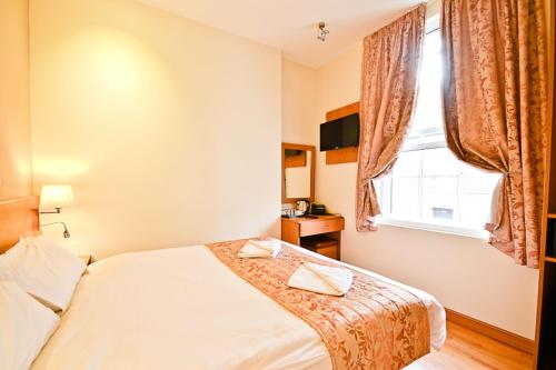 Habitación Doble del hotel Kings Cross Inn. Foto 1