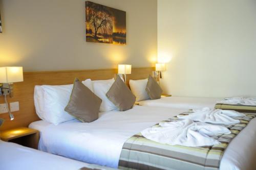 Habitación Triple del hotel Kings Cross Inn. Foto 1