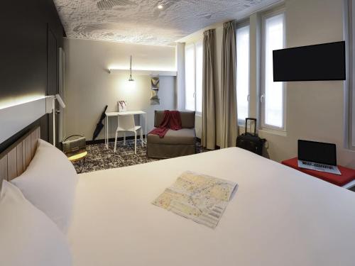 Habitación Estándar - 1 cama doble y 1 individual del hotel ibis Paris Gare de L' Est 10ème. Foto 1