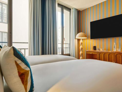 Habitación Doble Estándar - 2 camas del hotel Mercure Paris Butte Montmartre Basilique. Foto 1
