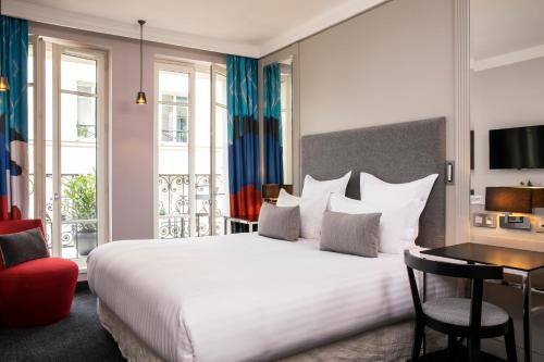 Habitación Executive con balcón y acceso al spa del hotel Les Matins De Paris and Spa. Foto 4