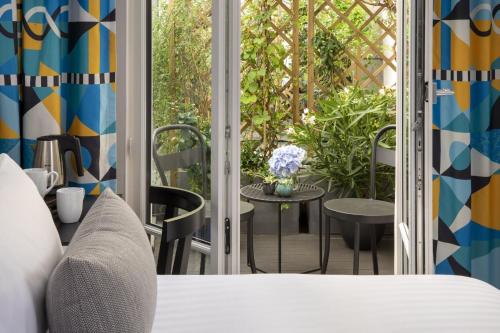 Habitación Superior con terraza y acceso al spa del hotel Les Matins De Paris and Spa. Foto 3