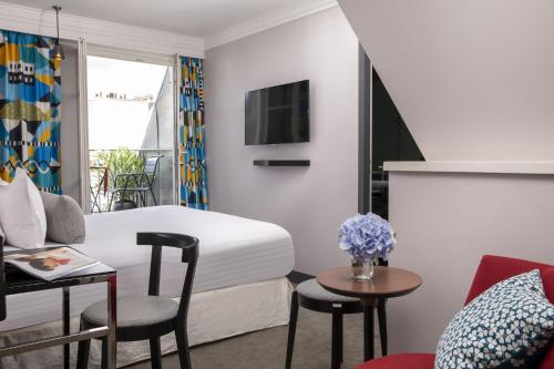 Habitación Deluxe con terraza y acceso al spa del hotel Les Matins De Paris and Spa. Foto 3