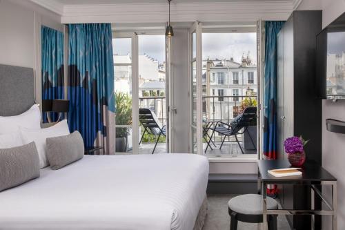 Habitación Deluxe con terraza y acceso al spa del hotel Les Matins De Paris and Spa. Foto 4