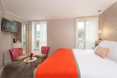 Habitación Doble Deluxe - 1 o 2 camas del hotel Vic Eiffel. Foto 1