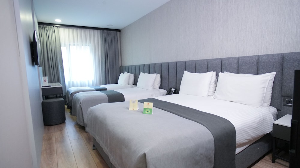 Habitación cuádruple estándar del hotel Dosso Dossi Hotels Old City. Foto 1