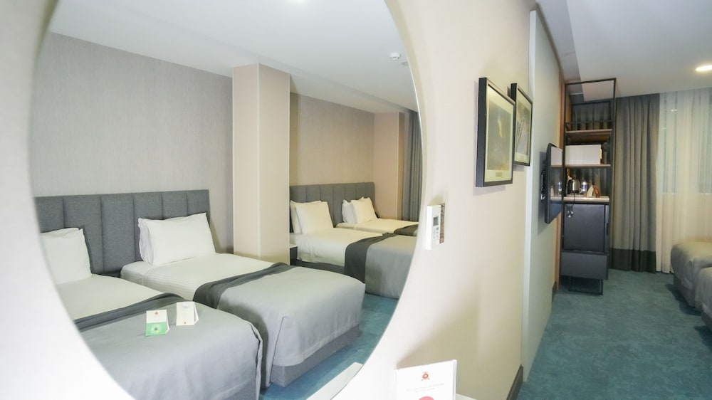 Habitación cuádruple estándar del hotel Dosso Dossi Hotels Old City. Foto 6
