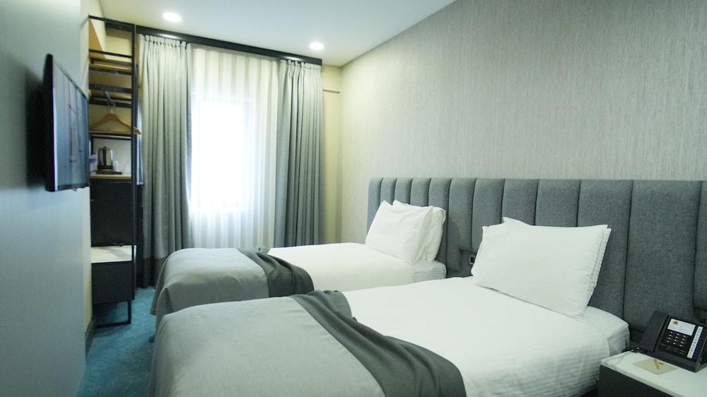 Habitación familiar con 1 cama doble o 2 individuales (Two Connecting) del hotel Dosso Dossi Hotels Old City. Foto 7
