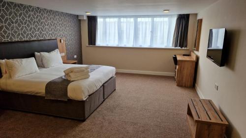 Habitación Superior con cama extragrande - Adaptada para personas de movilidad reducida del hotel Best Western Northfields Ealing. Foto 4