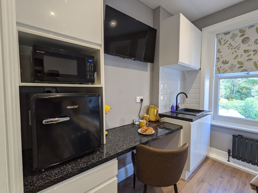 Estudio, baño privado (Studio Suite) del hotel Charlotte Guest House. Foto 1