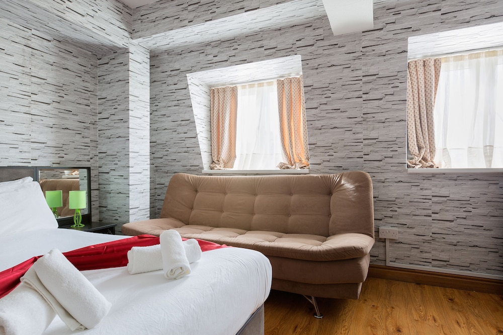 Habitación triple Confort, baño privado del hotel Central Hoxton Shoreditch. Foto 7