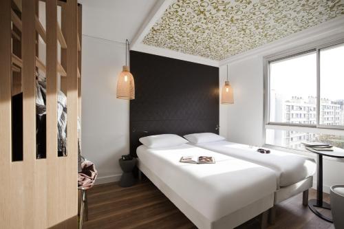 Habitación Doble - 2 camas del hotel Ibis Styles Paris Buttes Chaumont. Foto 7