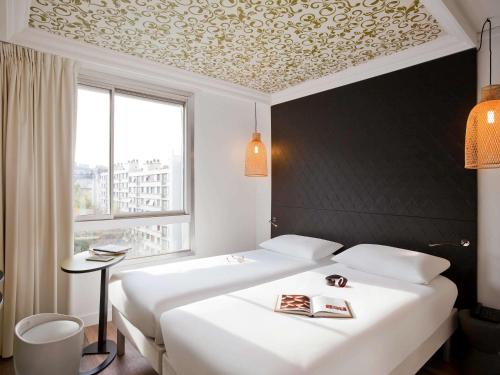Habitación Doble - 2 camas del hotel Ibis Styles Paris Buttes Chaumont. Foto 9