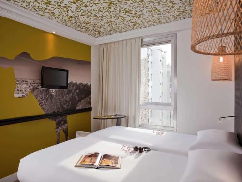 Habitación Doble - 2 camas del hotel Ibis Styles Paris Buttes Chaumont. Foto 12