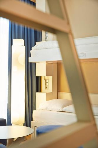 Habitación Cuádruple Confort del hotel H2 Hotel Munchen Messe. Foto 1