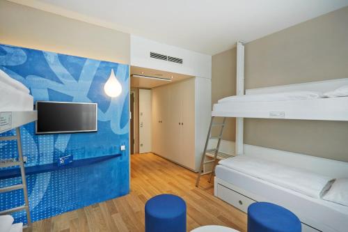 Habitación Cuádruple Confort del hotel H2 Hotel Munchen Messe. Foto 5