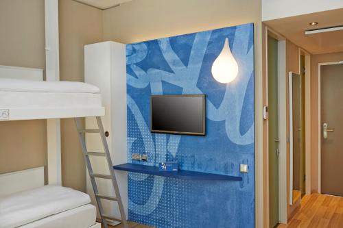 Habitación Cuádruple Confort del hotel H2 Hotel Munchen Messe. Foto 8
