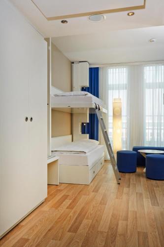 Habitación Cuádruple Confort del hotel H2 Hotel Munchen Messe. Foto 9