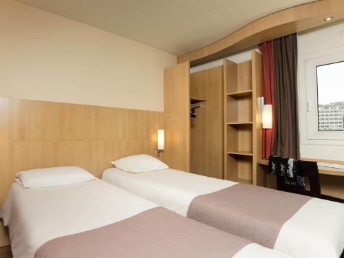 Habitación Estándar - 2 camas individuales del hotel Ibis Paris Issy Les Moulineaux Val De Seine. Foto 2