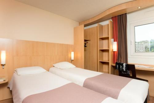 Habitación Estándar - 2 camas individuales del hotel Ibis Paris Issy Les Moulineaux Val De Seine. Foto 6