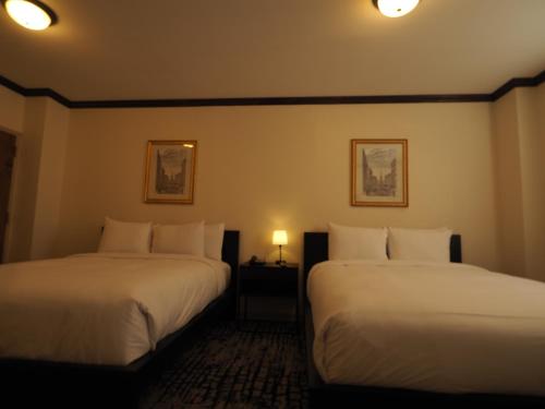 Alojamiento Oro - 2 camas dobles del hotel Night Broadway. Foto 2