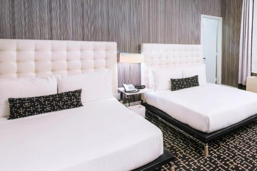 Habitación Doble Deluxe - 2 camas dobles del hotel Moderne. Foto 1