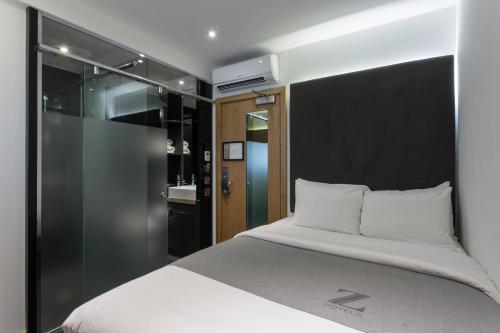 Habitación Doble sin ventana del hotel Z Piccadilly. Foto 1