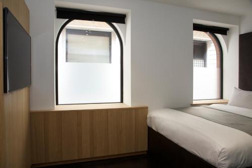 Habitación Club con 1 cama grande del hotel Z Piccadilly. Foto 1