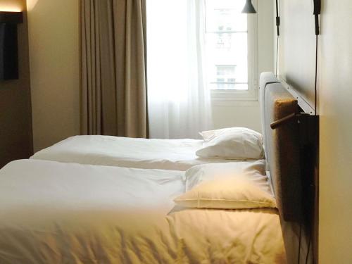 Habitación Doble Estándar - 2 camas del hotel Ibis Lille Centre Grand Place. Foto 3