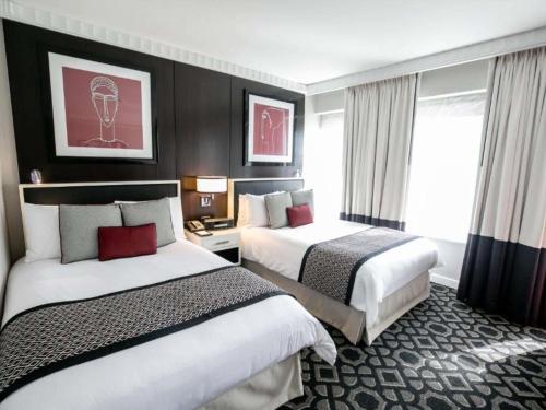 Habitación de lujo - 2 camas dobles del hotel Sofitel Washington Dc Lafayette Square. Foto 3