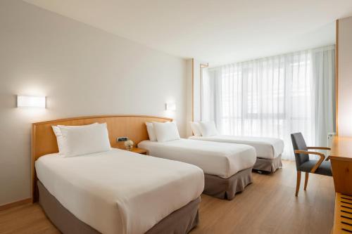 Habitación Triple del hotel Exe Area Central. Foto 3