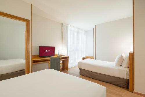 Habitación Triple del hotel Exe Area Central. Foto 4