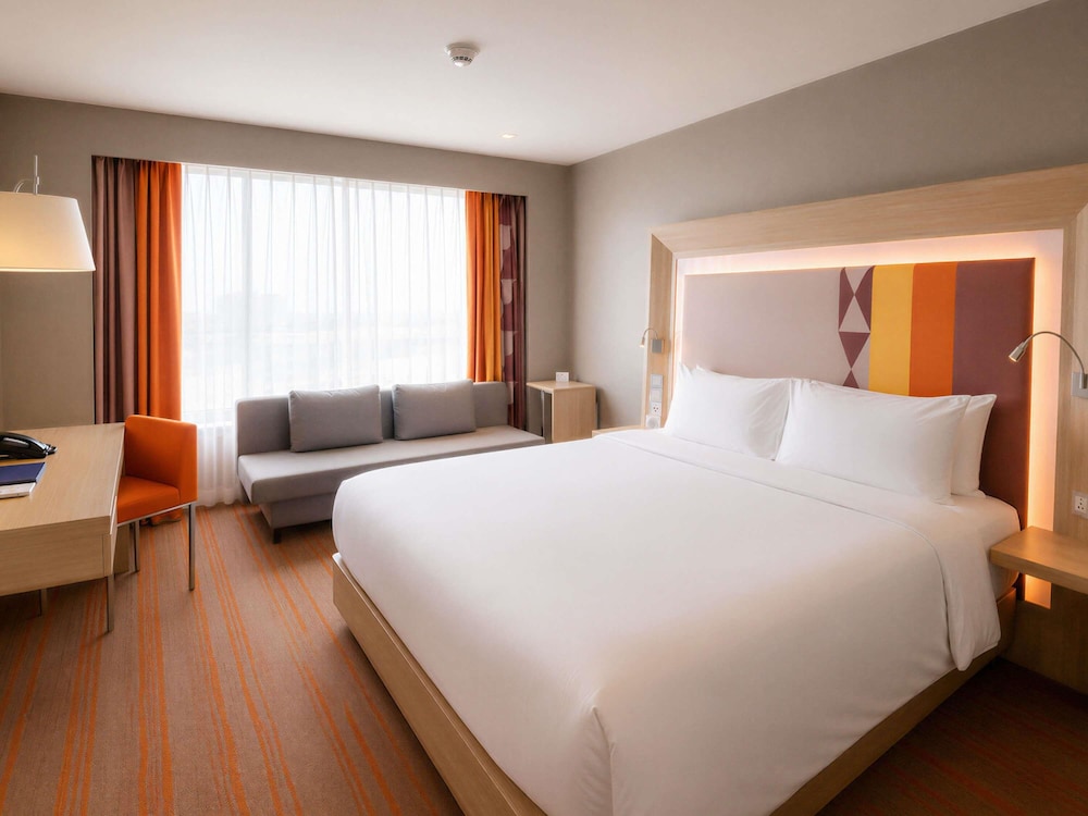 Habitación Deluxe con cama King del hotel Novotel Manila Araneta City