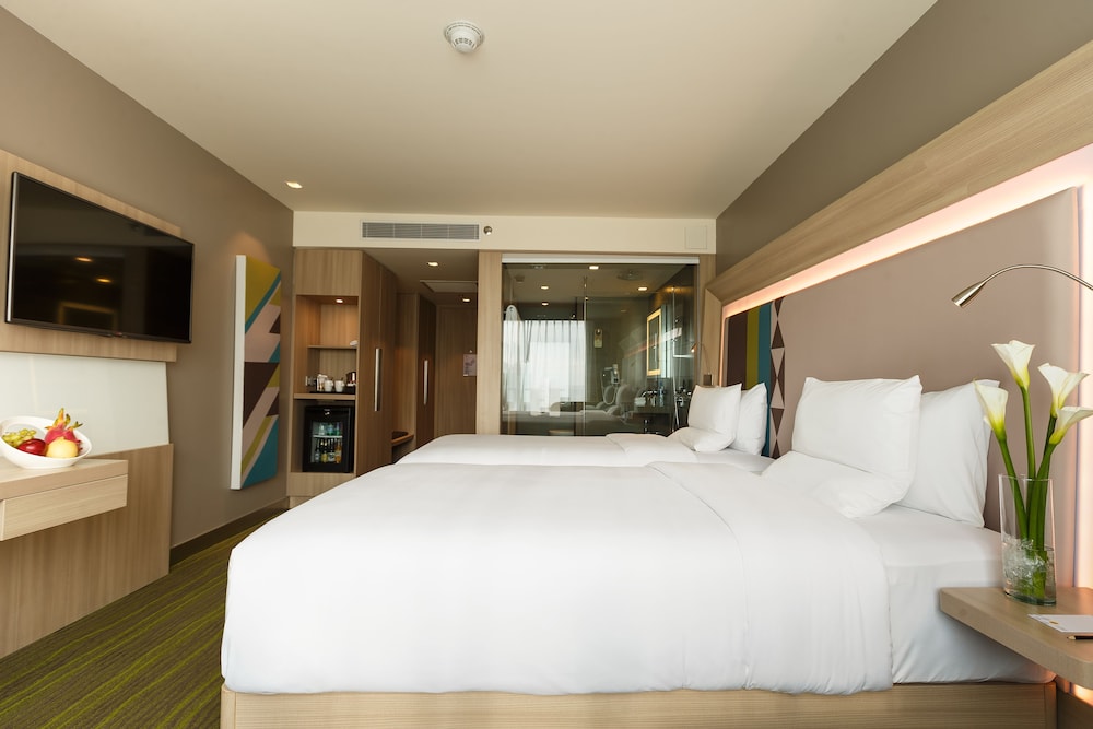 Habitación Superior con Dos Camas Individuales del hotel Novotel Manila Araneta City. Foto 1