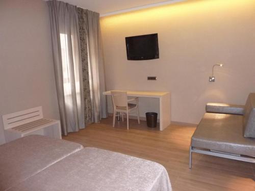 Habitación Triple del hotel Barcelona House. Foto 1