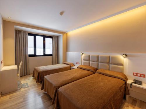 Habitación Triple del hotel Barcelona House. Foto 12